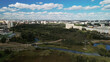 © f2014vad - City with high-rise buildings. Park area in the foreground. Blue sky with clouds. Aerial photography.