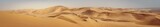Travel to Africa, adventures, safari or expedition to Namib desert, panoramic view. Wilderness with sandy dunes of Namibia. Panoramic landscape of Sandwich Harbour, view on skyline and high hills.