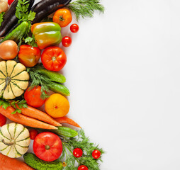 Set of fresh vegetables, herbs on a white background. Top view, copy space. Healthy food concept.