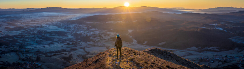 Panoramic of a Female Hiker Photographer Enjoying Moment of Sunr