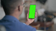 © stockbakers - Young African Businessman using Smartphone with Chroma Screen