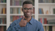 © stockbakers - Young African Man showing Thumbs Up Sign
