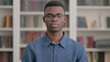 © stockbakers - Serious Young African Man Looking at the Camera