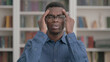 © stockbakers - Young African Man having Headache