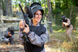 © JackF - Portrait of pleased woman in uniform with paintball gun