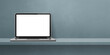 © daboost - Laptop computer on grey shelf background banner