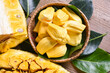 jackfruit on wooden basket with leaf, ripe jackfruit peeled tropical fruit fresh from jackfruit tree - top view