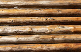 Fototapeta Desenie - background of wooden log cabins wood