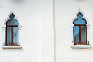 Wall Mural - Close-up of two ancient windows with arch in Venetian Gothic style, small town of Spilimbergo, Pordenone province, Friuli-Venezia Giulia, Italy, Europe.