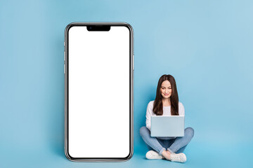 Full length photo of smart young lady type laptop wear casual cloth isolated on blue background