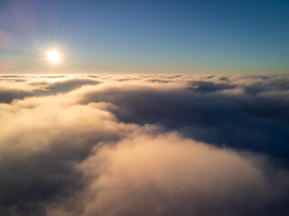 Poster - Day photo of plane flying over the clouds. Calm photo above the clouds