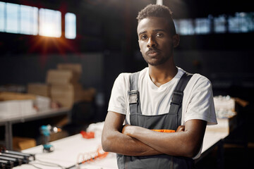 Wall Mural - portrait of african engineer working at factory