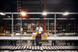 © sata_production - African factory worker with a box at the storage