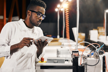 Wall Mural - african engineer with tablet at factory