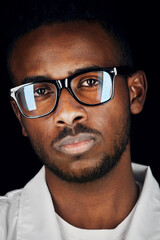 Wall Mural - close up portrait of african man in glasses