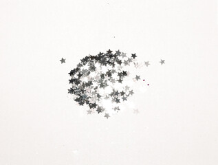 Wall Mural - Silver glitter and glittering stars on gray background