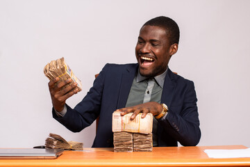 Wall Mural - happy african businessman with lots of money