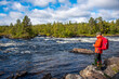 © citikka - Woman hiking in forest in Finland Lapland