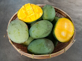 Poster - Kweni or mangifera odorata. Kweni fruit in a basket.