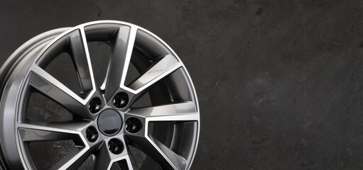 Wall Mural - grey beautiful stylish alloy wheel details on a dark background copy space autotuning