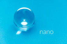 Blue Glass Sphere And The Word Nano As A Concept For Nano Particel