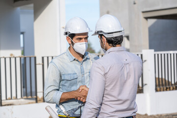 Poster - Engineer discussing with Architect about project in building construction site.