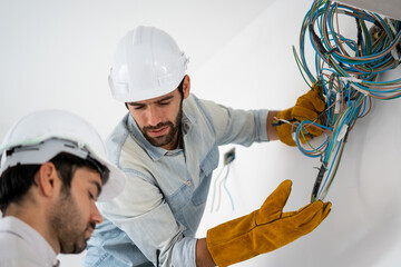 Fototapete - Electrician working with cable on the construction site,House and house reconstruction,Repairing light at home,repair work.