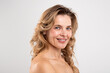 © Prostock-studio - Smiling Attractive Middle Aged Lady With Bare Shoulders Posing Over Grey Background