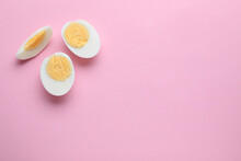 Fresh Hard Boiled Eggs On Pink Background, Flat Lay. Space For Text