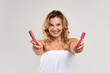© Prostock-studio - Happy Beautiful Middle Aged Female Showing Two Colour Lipsticks At Camera