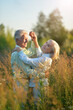 © aletia2011 - Beautiful elderly couple dancing together in nature