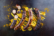 Barbecue Allgäu bratwurst served with hot mustard and curry as top view on a rustic old board