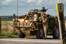Army Reconnaissance Vehicle In Action On A Military Exercise
