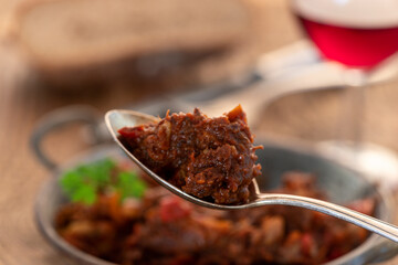 Poster - portion of austrian goulash on wood