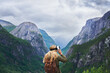 © AILA/peopleimages.com - Adventure woman wearing vr headset augmented virtual reality in beautiful mountain landscape concept