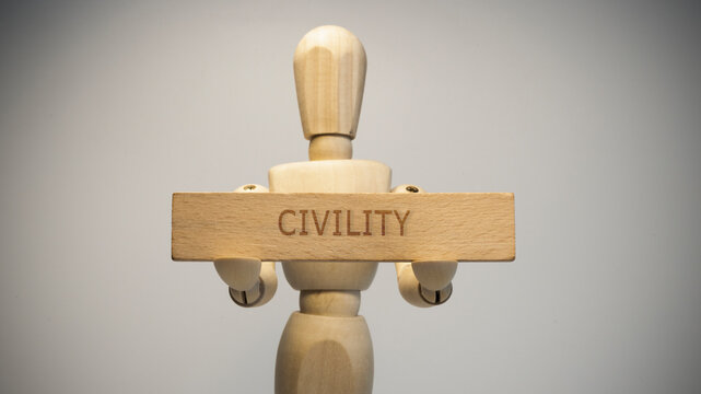 Civility was written on a wooden surface. Close-up in the studio. social issues.