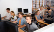 © JackF - Teenage boys and girls using computers in IT room