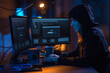 © Syda Productions - cybercrime, hacking and technology concept - female hacker in dark room writing code or using computer virus program for cyber attack