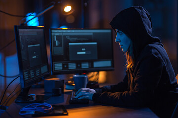 Canvas Print - cybercrime, hacking and technology concept - female hacker in dark room writing code or using computer virus program for cyber attack