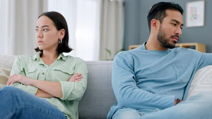 Wall Mural - Fight, divorce and angry couple on a sofa in living room at home with husband hurt after erectile dysfunction argument. Marriage, infertility and upset man on the couch with his frustrated young wife