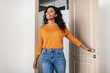 Happy Black Young Woman Entering Apartment Opening Entry Door