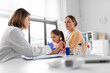 © Syda Productions - medicine, healthcare and pediatry concept - female doctor or pediatrician with syringe making vaccine injection to little girl patient at clinic