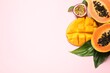 Fresh ripe papaya and other fruits on pink background, flat lay. Space for text