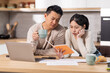 © Prostock-studio - Asian family planning monthly budget together, kitchen interior