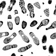 Vector seamless pattern image double footprints black footprints on white background