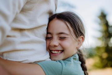 Wall Mural - Little girl hugging her father, close up. Father's day concept.