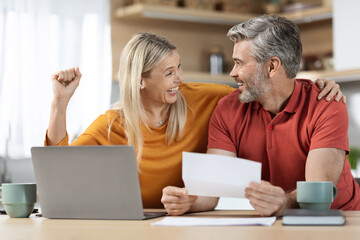 happy emotional spouses reading letter, kitchen interior