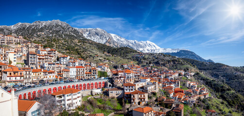 panorama of the town arachova, greece, next to parnassus mountain during a sunny winter day with sno