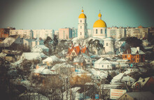 Urban View With A Temple With Yellow Domes