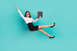 © deagreez - Full body photo of excited crazy lady hold use wireless netbook falling isolated on emerald color background